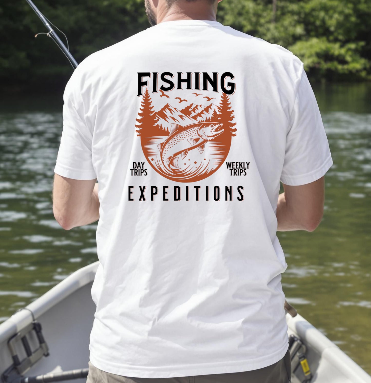 "White T-shirt with trout fishing expedition design reading 'Fishing – Day Trips, Weekly Trips, Expeditions' worn by angler in a boat"