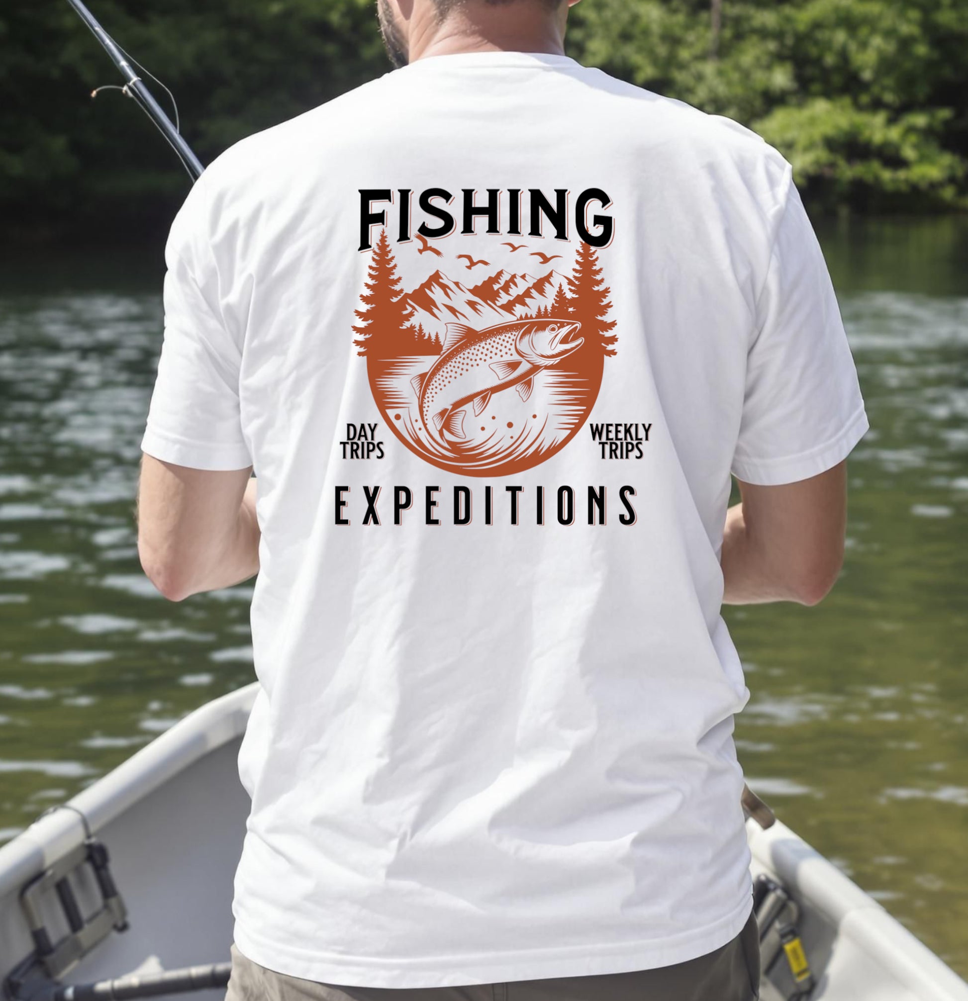 "White T-shirt with trout fishing expedition design reading 'Fishing – Day Trips, Weekly Trips, Expeditions' worn by angler in a boat"